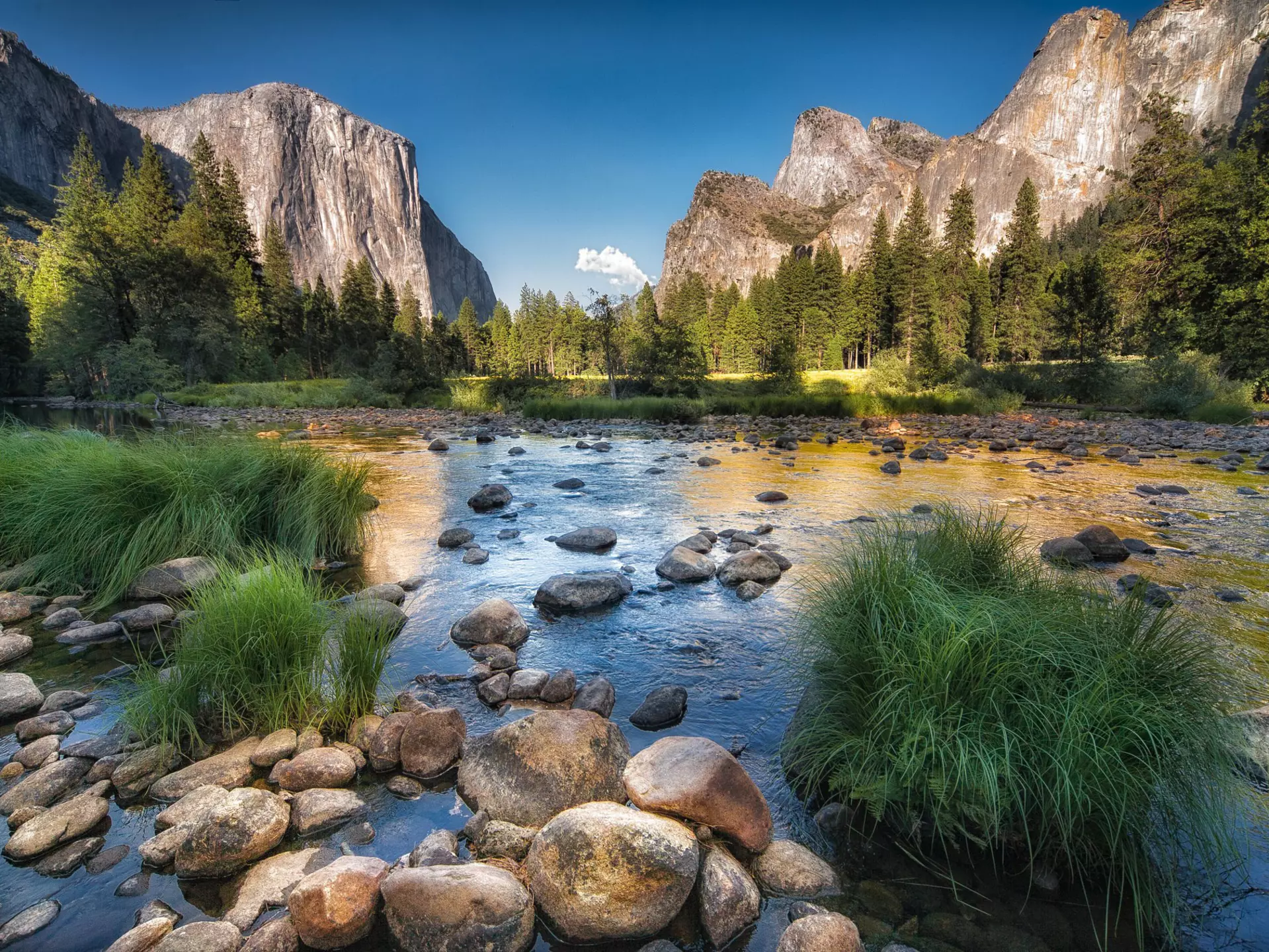 Typical view of the Yosemite National Park.
174714872
usa, sun, hdr, sky, tree, park, rock, pine, high, blue, peak, stone, green, river, grass, range, color, water, autumn, travel, massif, valley, summer, forest, beauty, scenic, nature, outdoor, natural, reserve, sunrise, captain, tourist, tourism, sunlight, national, landmark, monolith, mountain, yosemite, cathedral, landscape, california, reflection, destinations, capitan, el