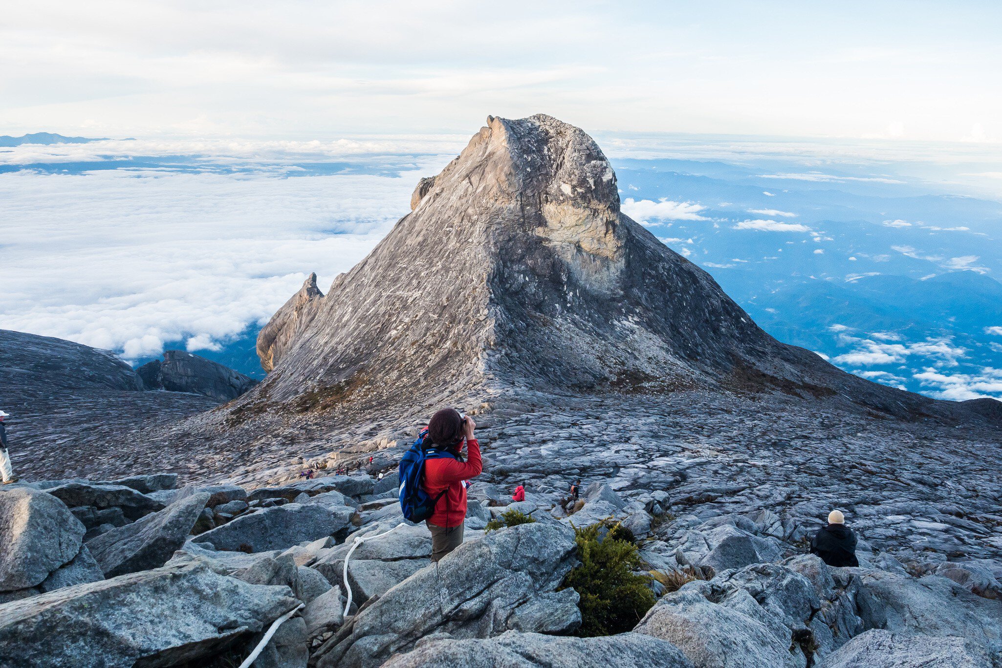 23 April, 2018: hikers pause to photograph the Mount Kinabalu peak (4095m).
1081670372
adventure, altitude, asia, asian, beautiful, blue, borneo, climb, climbing, cloud, clouds, heritage, high, hiking, hill, journey, kinabalu, kota, landscape, malaysia, mount, mountain, mountains, mt, natural, nature, outdoor, outdoors, park, peak, people, recreation, rock, sabah, scenery, scenic, sky, south, summit, sunrise, top, tourism, travel, trekking, unesco, view