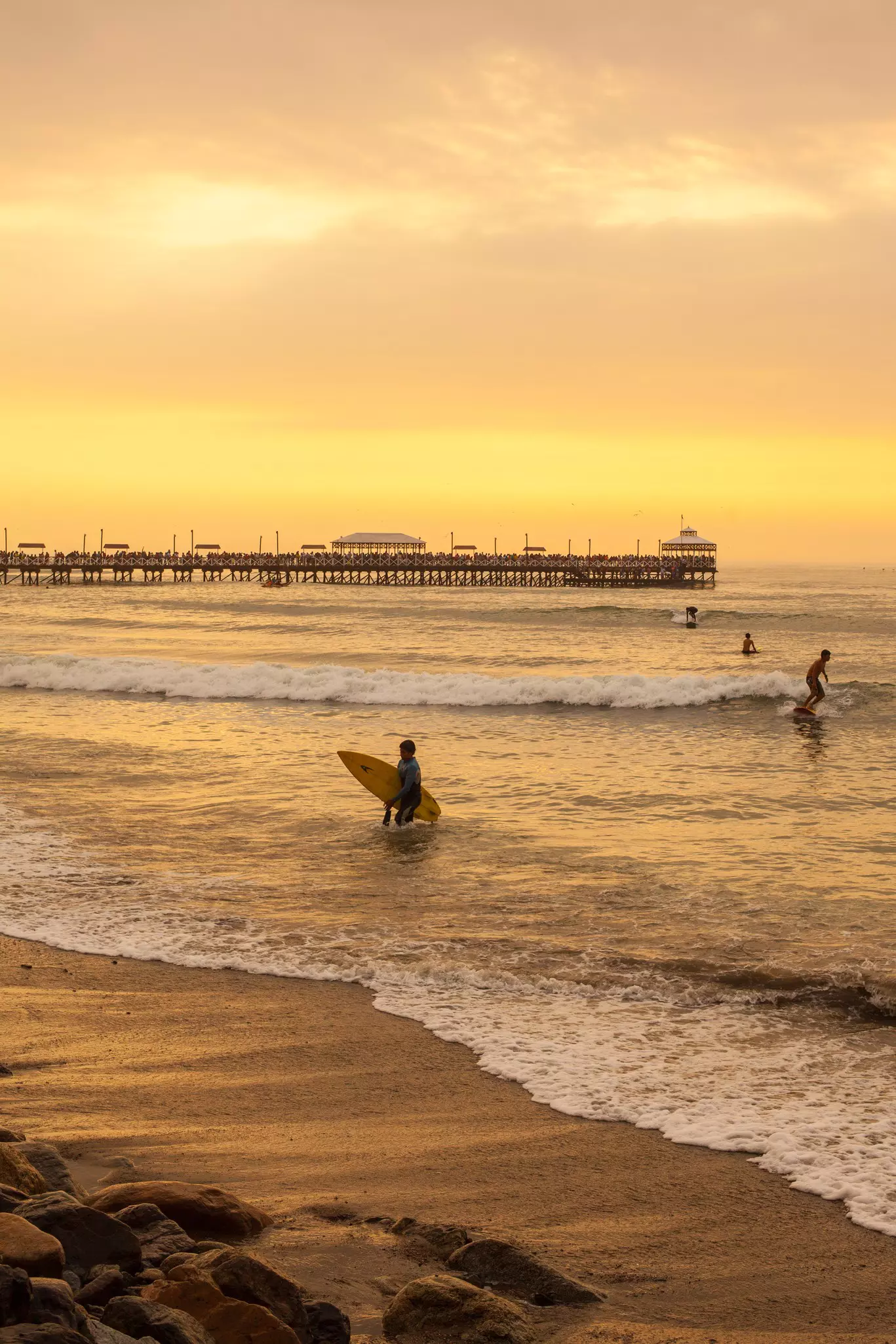Sunset surfers in Peru. Geraint Rowland/Getty Images