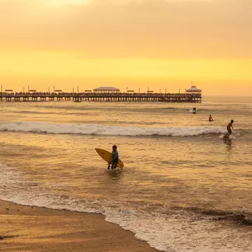 Surfers ride waves during sunset at Huanchaco in Peru.
Travel, Sunlight, Surf, South America, Trujillo, Wave - Water, Pier, Fishing, Summer, Real People, Color Image, Tranquility, Huanchaco, Back Lit, Equipment, Surfboard, Eco Tourism, Trujillo - Peru,...