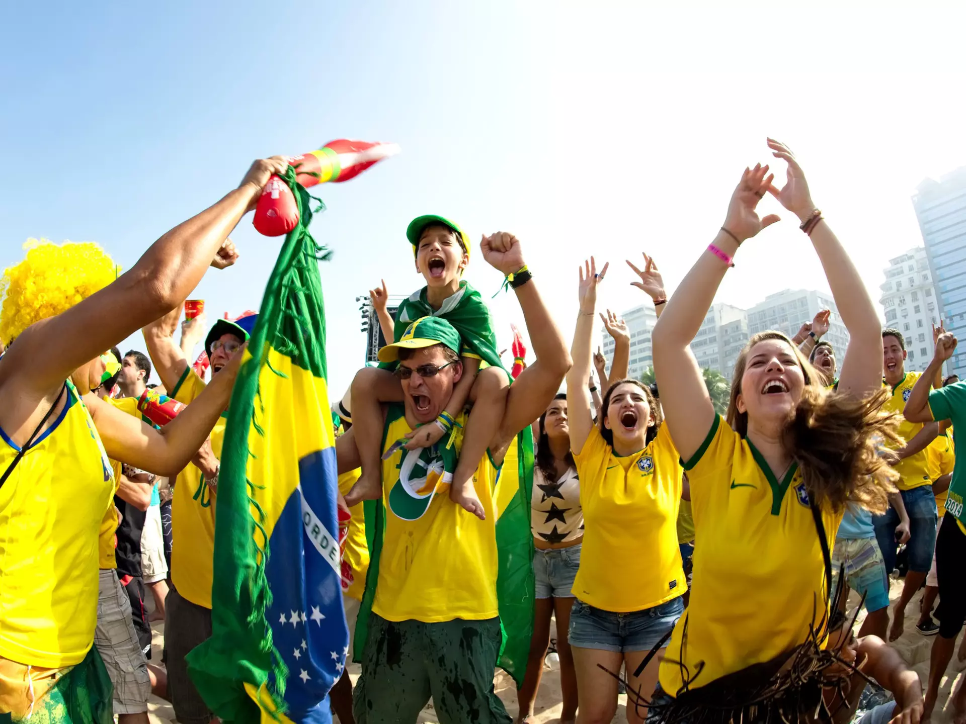 Supporters celebrate at the Fifa Fan Fest area on Copacabana beach during a match high on emotion and drama between Brazil and Chile