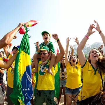Supporters celebrate at the Fifa Fan Fest area on Copacabana beach during a match high on emotion and drama between Brazil and Chile