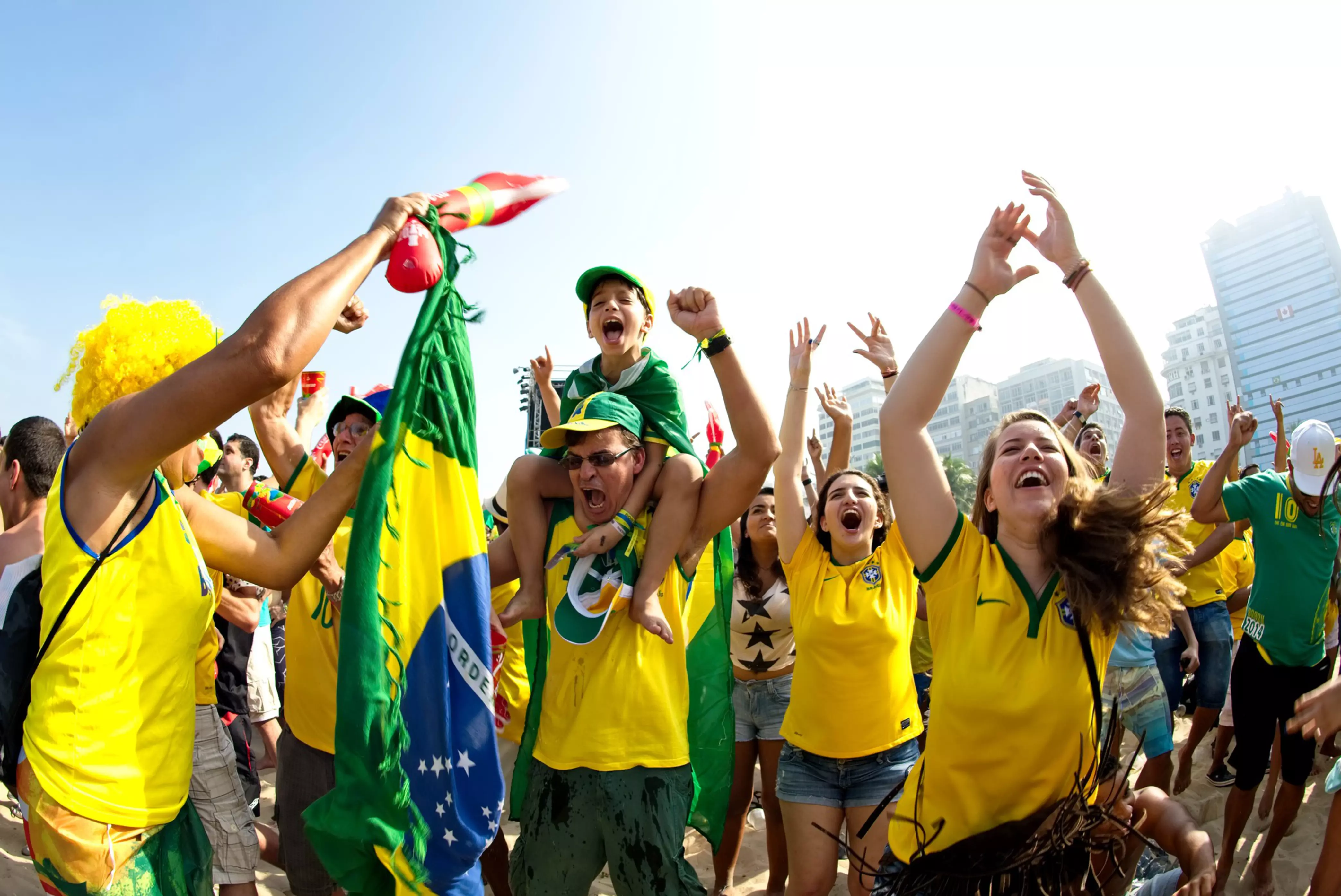 Supporters celebrate at the FIFA Fan Fest area on Copacabana beach during a match