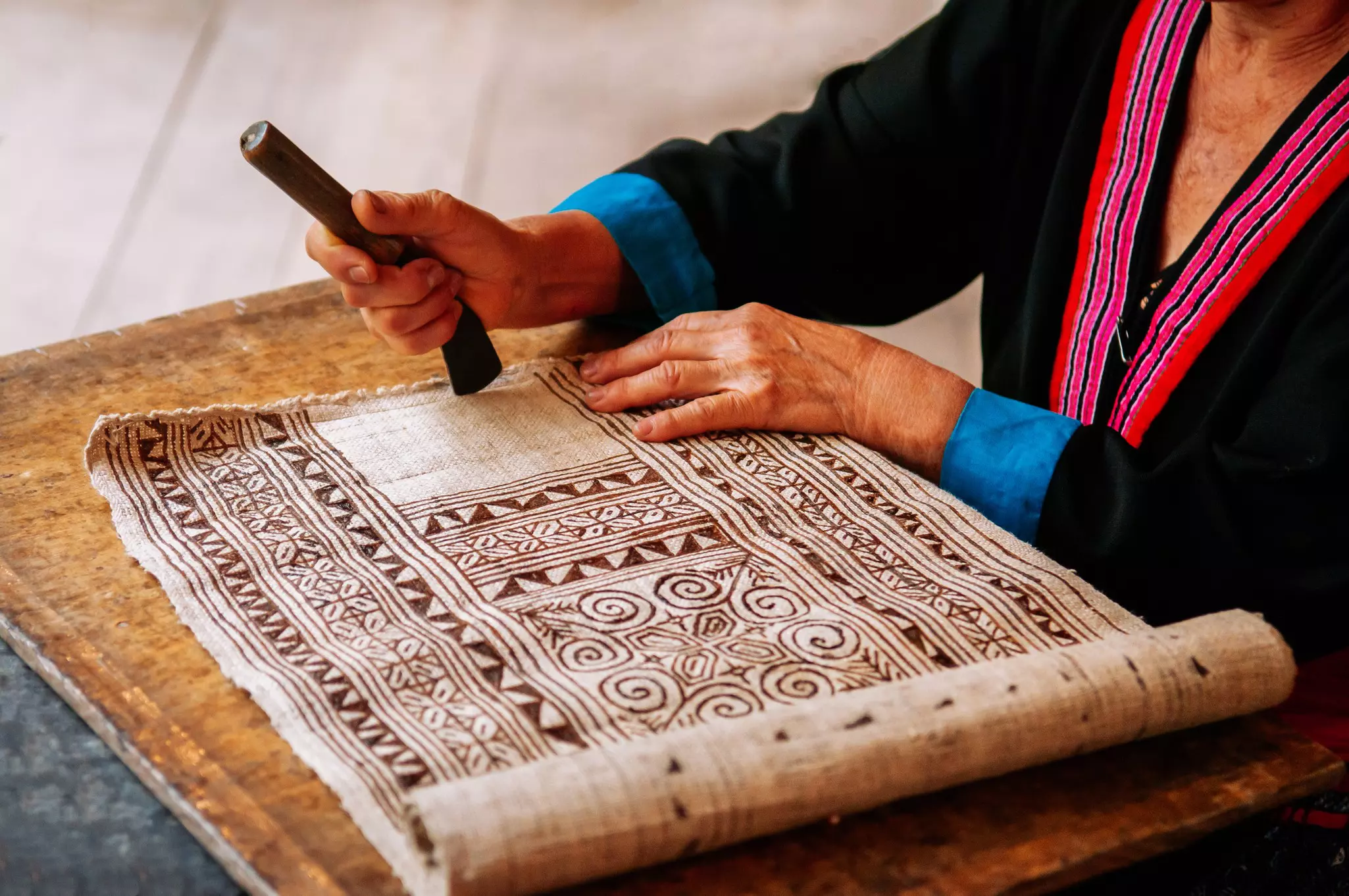 Luang Prabang, Laos - Hilltribe Laotian woman working on Batik fabric painting. Culture tourism at Ock Pop Tok handicraft center, License Type: media, Download Time: 2025-11-25T18:50:24.000Z, User: clairenaylor, Editorial: false, purchase_order: 65050 - Digital Destinations and Articles, job: Online editorial, client: Luang Prabang things to do, other: Claire Naylor