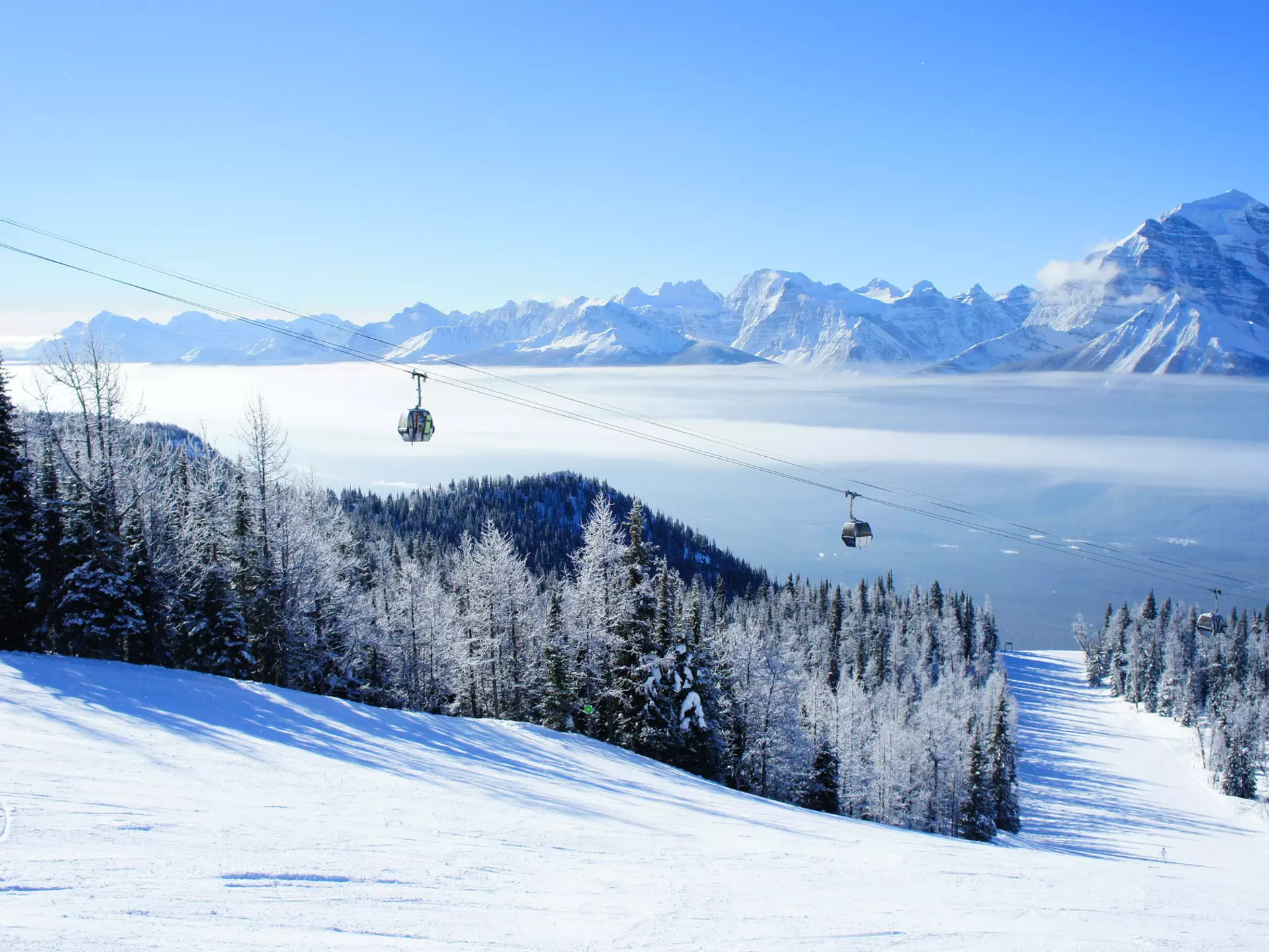 Picture of temperature inversion at Lake Louise, causing a cloud of sea with gondola visible., License Type: media, Download Time: 2025-12-04T23:48:55.000Z, User: catalinaaragon, Editorial: false, purchase_order: 56530 - Guidebooks, job: Global Publishing WIP, client: Canada 17, other: Canada 17