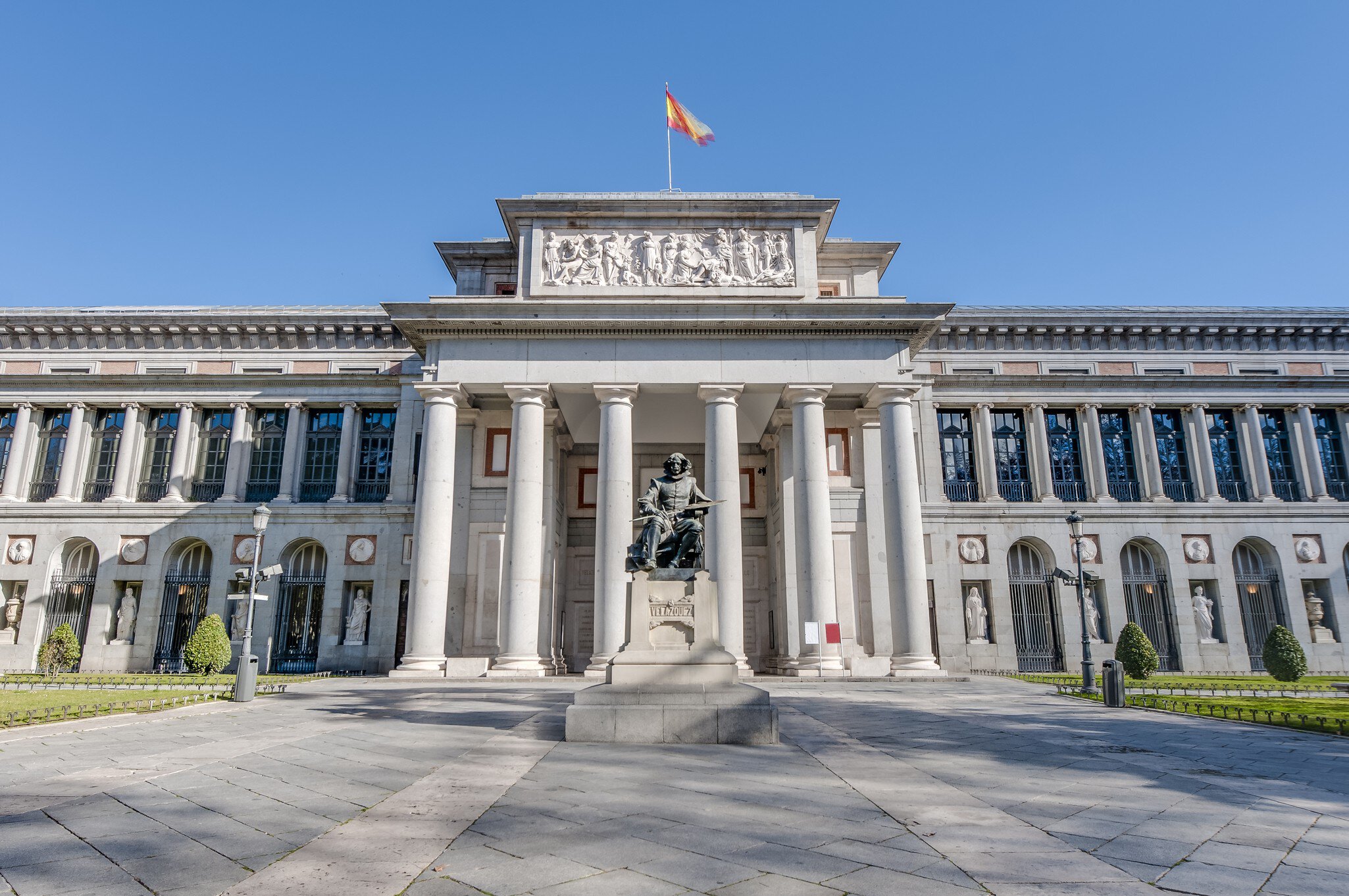 The facade of the Prado Museum and the Cervantes statue in Madrid, Spain