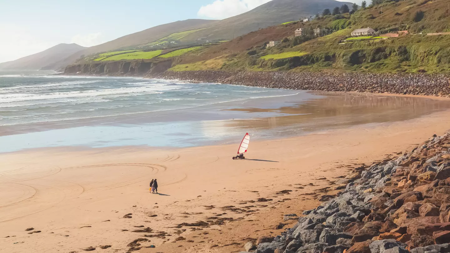 People enjoying the sand at Banna Strand, County Kerry.