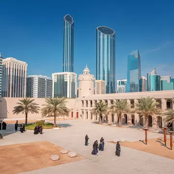 16 January 2025, Abu Dhabi, UAE: Group of tourists walking in the courtyard Qasr Al Hosn Heritage site, with the modern skyline in the background, License Type: media, Download Time: 2026-06-17T14:53:07.000Z, User: pinkjozie64, Editorial: true, purchase_order: 56530 - Guidebooks, job: Global Publishing WIP, client: DUBAI & ABU DHABI 12, other: Jo-anne Riddell