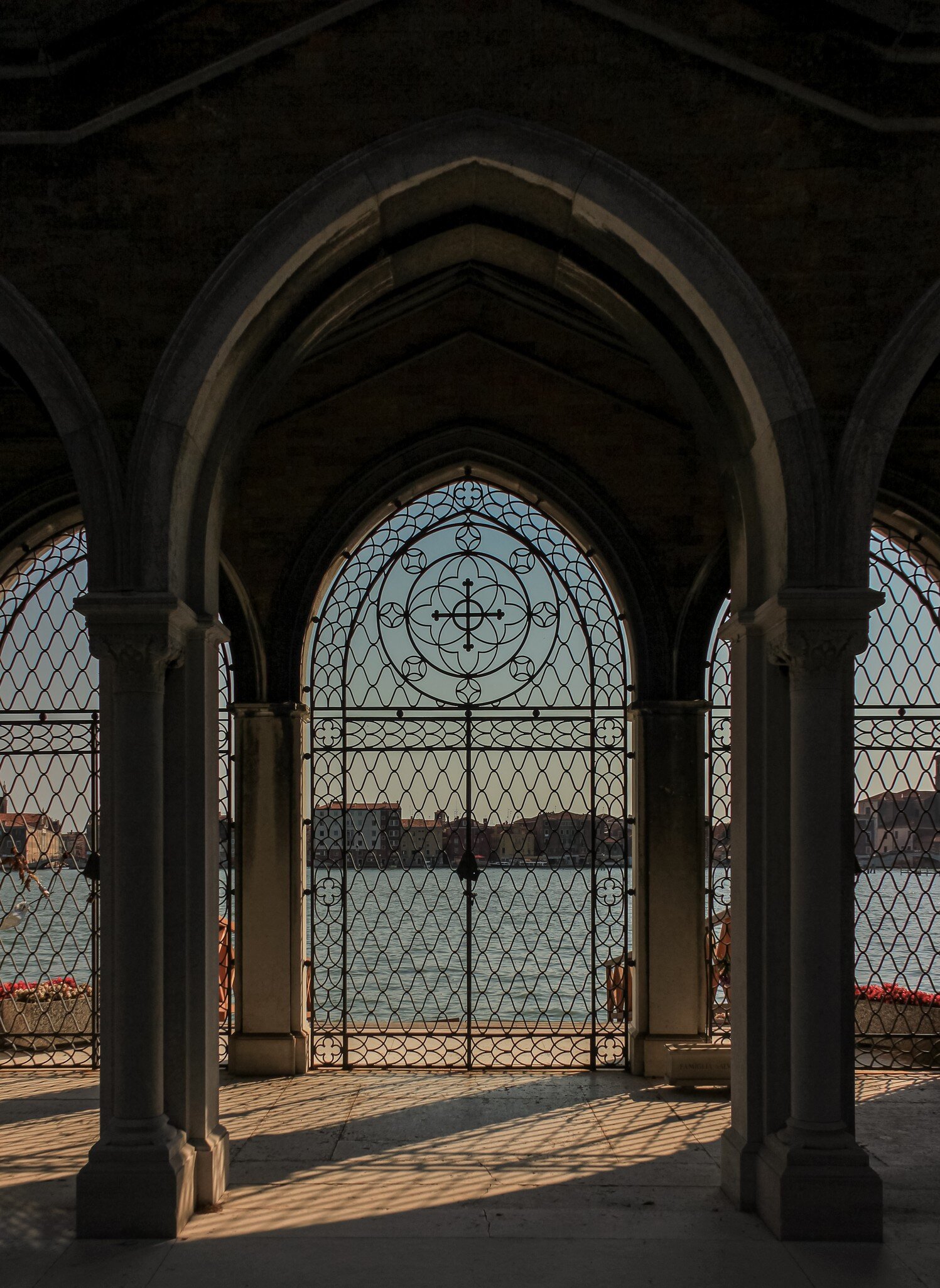 View of the sea from a gate at the Cimitero di San Michele in Venice, Italy.