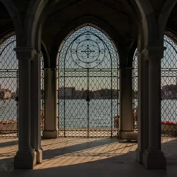 View of the sea from a gate at the Cimitero di San Michele in Venice, Italy.