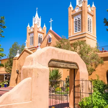 front entrance to the beautiful adobe San Felipe de Neri Church in Albuquerque, New Mexico