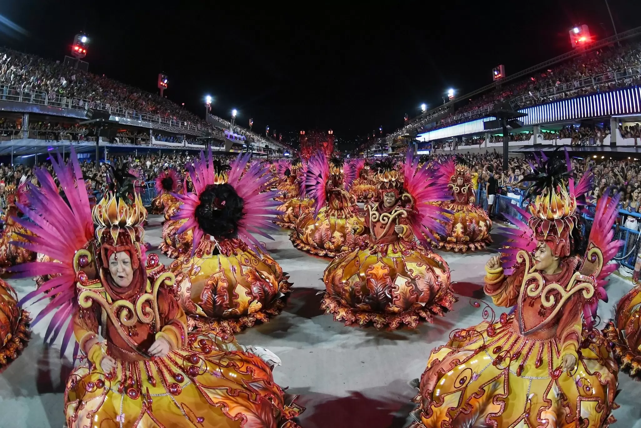 View of dancers performing in the parade of the samba schools during the carnival in the city of Rio de Janeiro, Brazil.