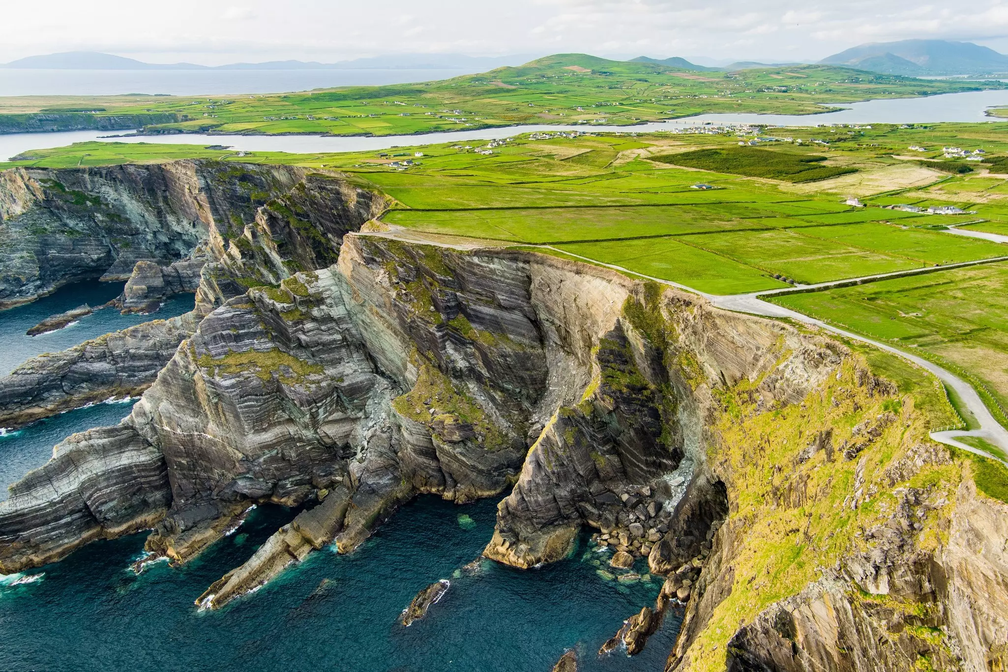 Waves crash on the Kerry Cliffs, widely accepted as the most spectacular cliffs in County Kerry, Ireland.
