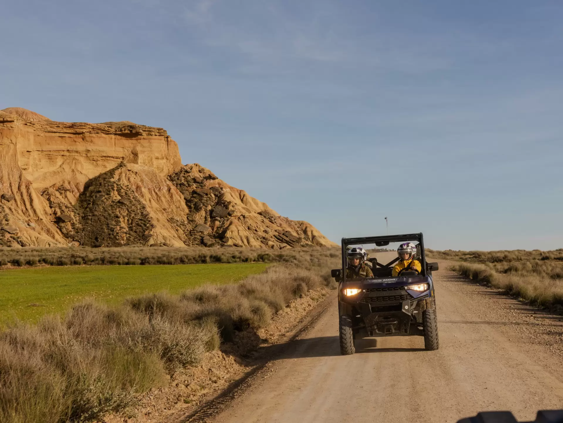 A buggy drives through the dry landscape of Bardenas Reales Nature Preserve. 
