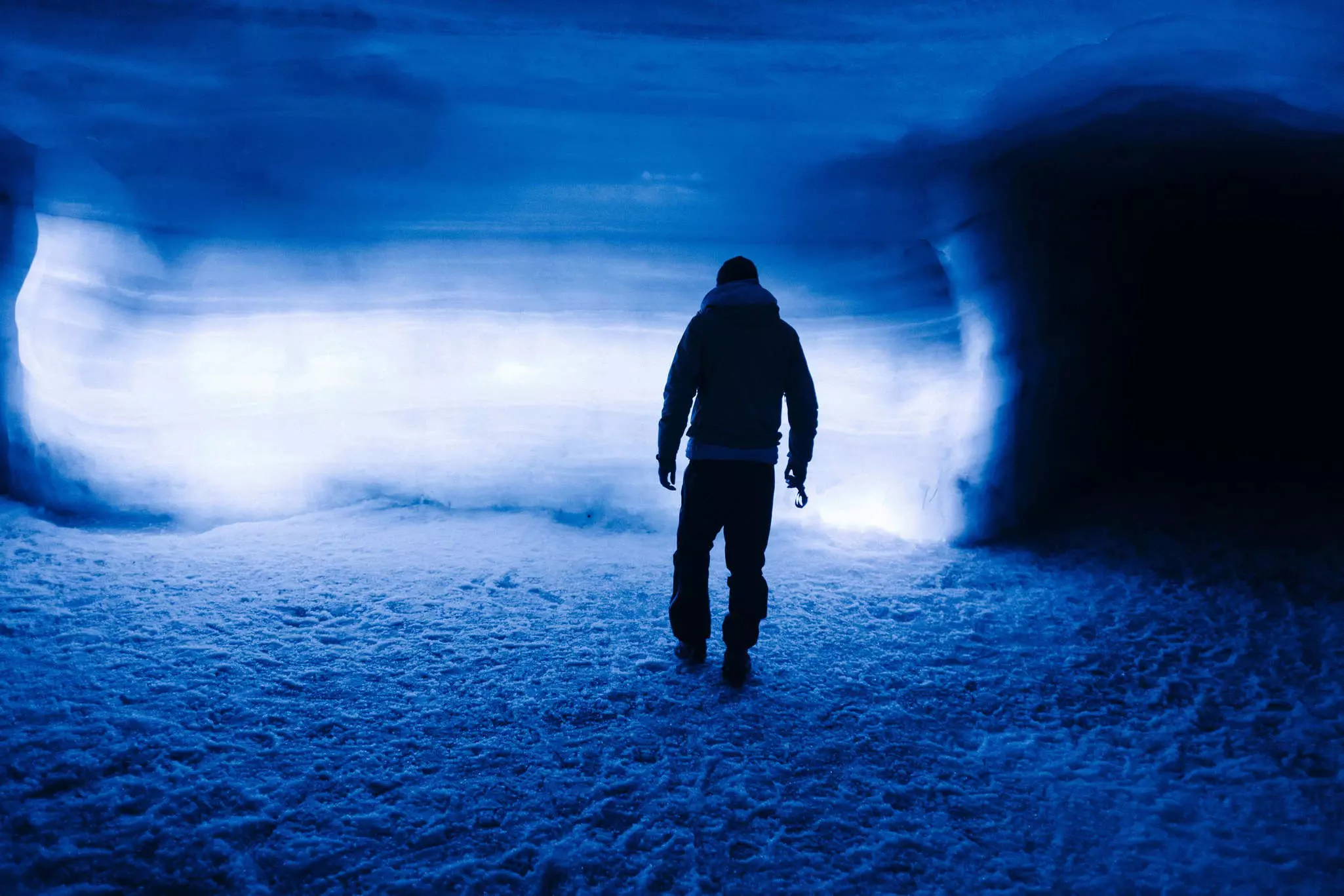 Silhouette of a person inside Langjökull glacier, Iceland.