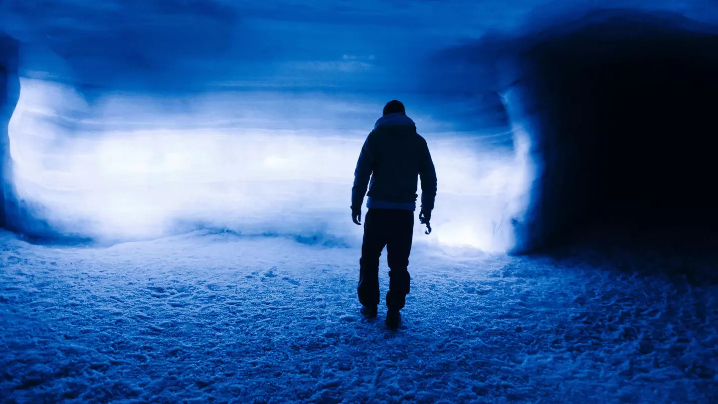 Silhouette of a person inside Langjökull glacier, Iceland.