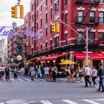 August 26, 2017: Corner of Mulberry Street and Broome Street, Manhattan, near the 'Welcome to Little Italy' sign.