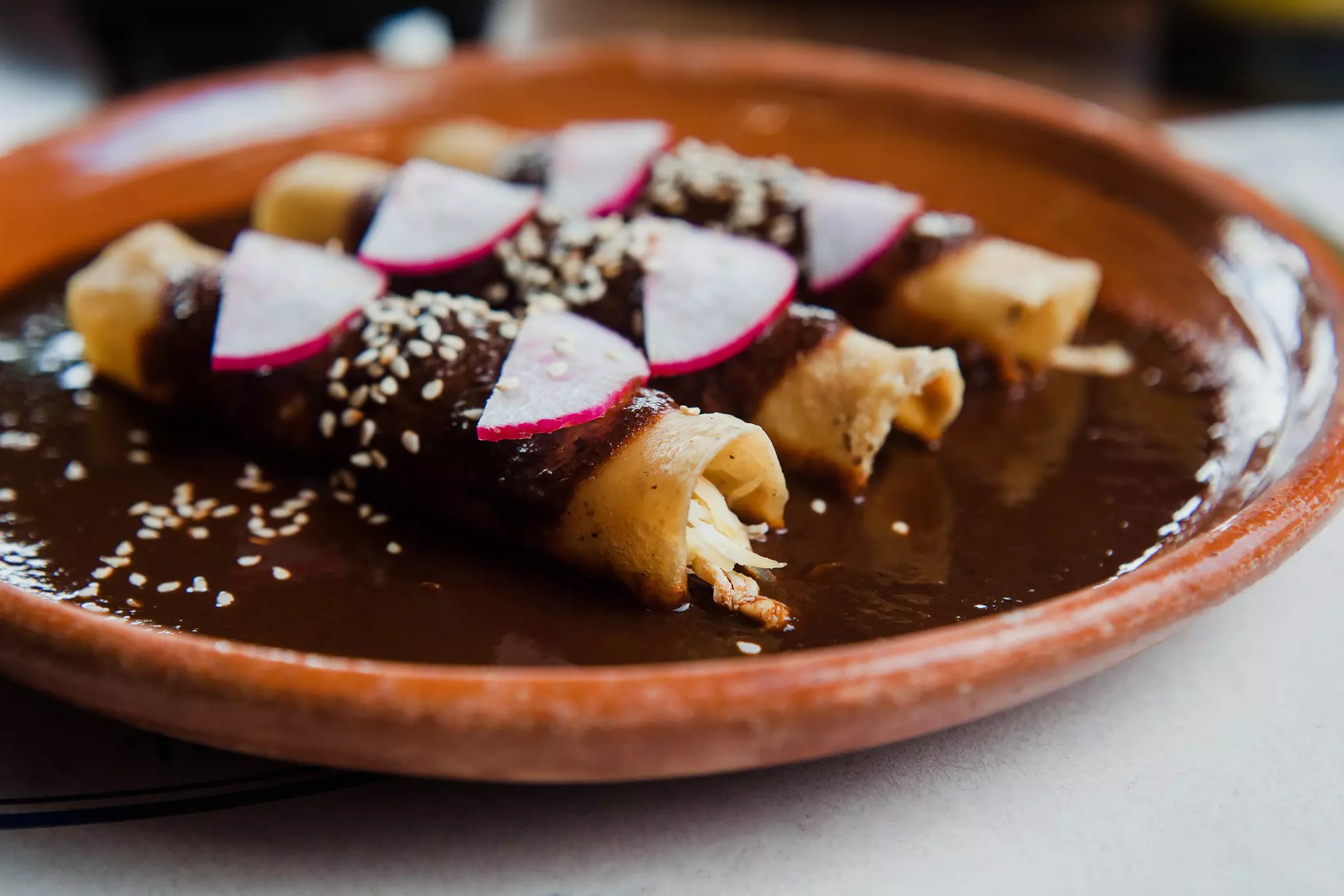 Mexican chicken enchiladas with mole poblano.