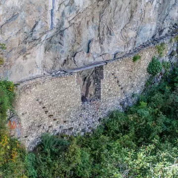 Inca Drawbridge carved into a stone wall near the Machu Picchu ruins, Peru.