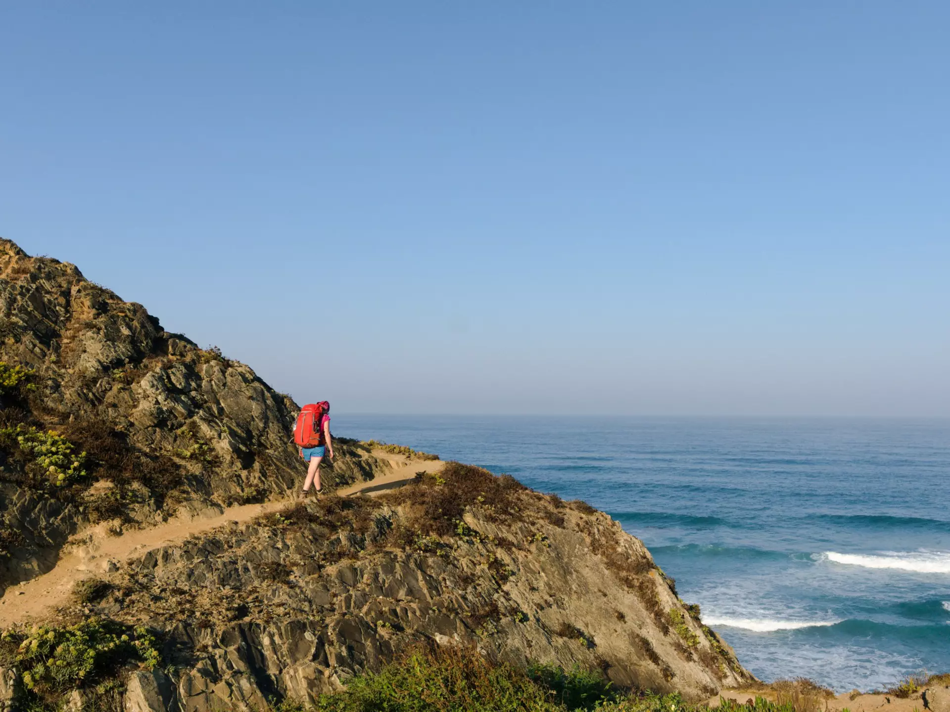 A hiker on the Fisherman’s Trail along Portugal’s southwestern coast. Y. Zhao/Shutterstock