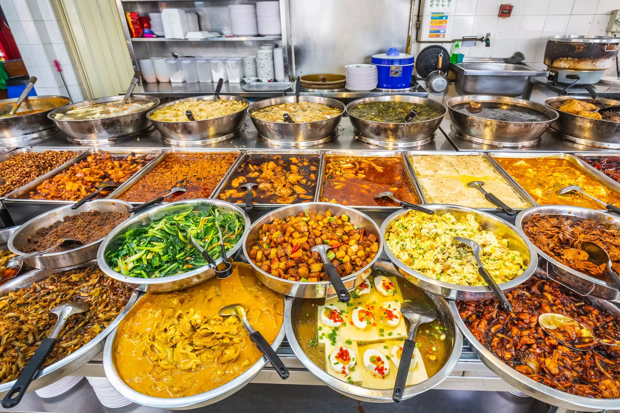 An assortment of food in serving dishes at Newton Food Center