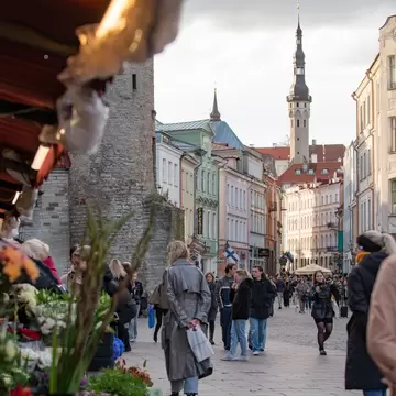 A flower stand in a historic city center.