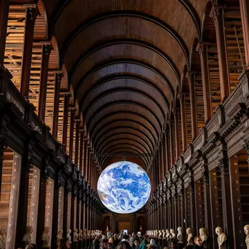 Dublin, Ireland. March, 1, 2025. Trinity College Library, which currently houses the stunning Gaia installation, a spectacular illuminated sculpture of the Earth created by Luke Jerram., License Type: media, Download Time: 2025-12-04T16:08:08.000Z, User: nic.dhoedt_lonelyplanet, Editorial: true, purchase_order: 56530 - Guidebooks, job: Global Publishing WIP , client: Lonely Planet Ireland 17, other: Nicolas D'Hoedt