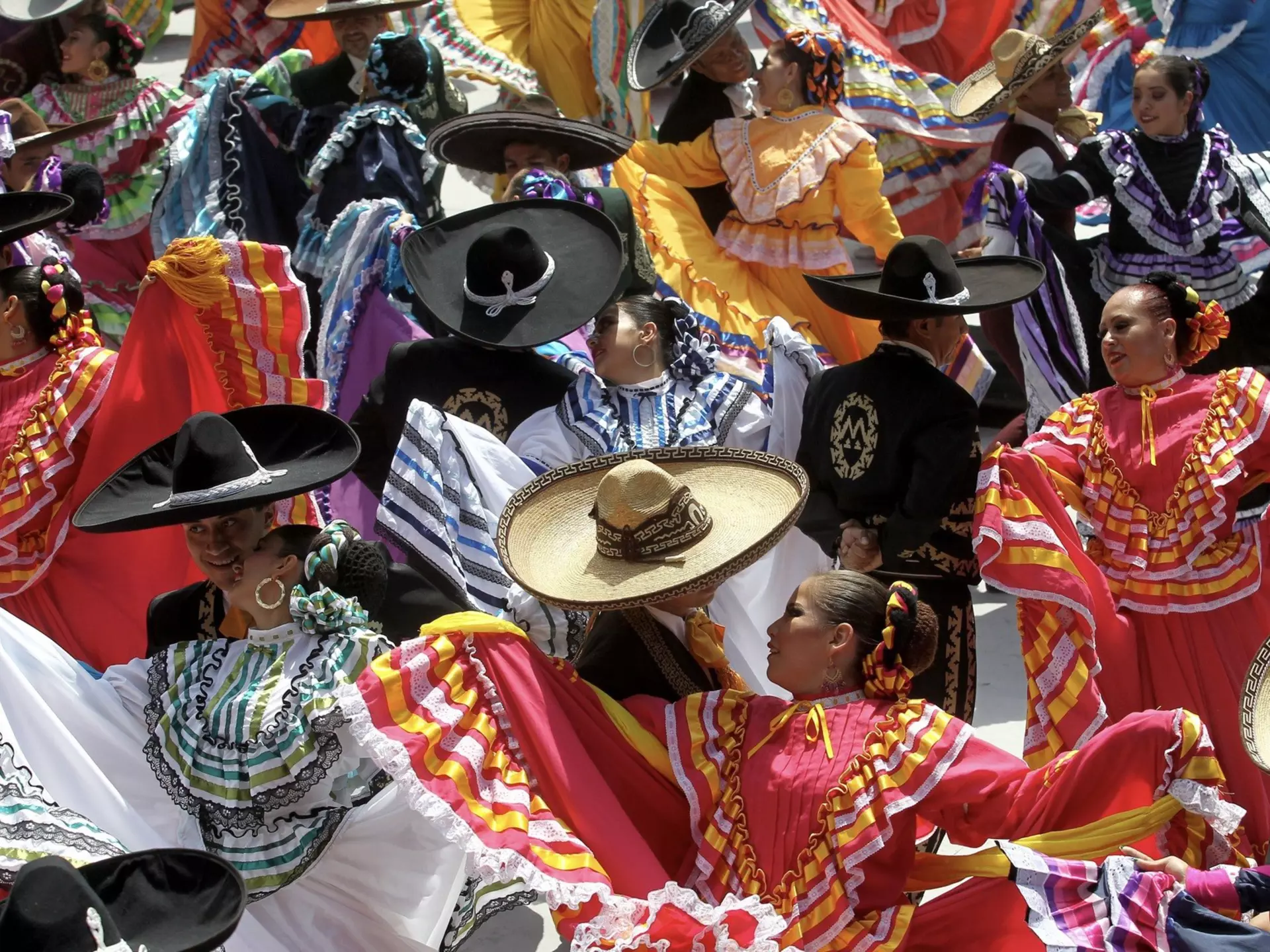Couples dancing to mariachi at start of a festival in Guadalajara. Ulises Ruiz/AFP via Getty Images