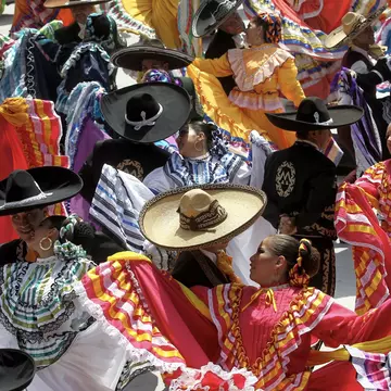 Couples dancing to mariachi at start of a festival in Guadalajara. Ulises Ruiz/AFP via Getty Images