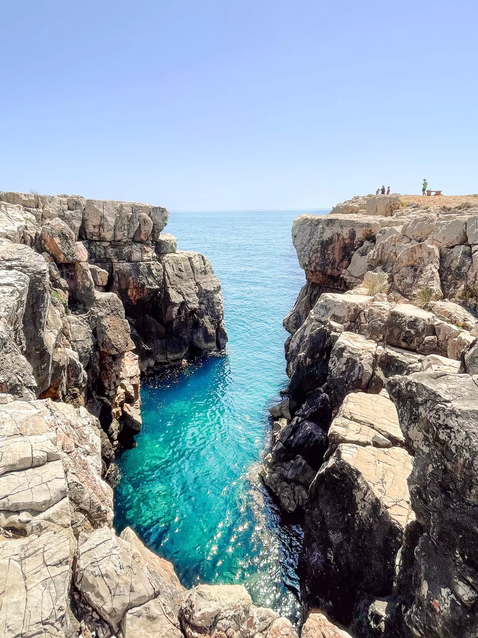 High cliffs of Lokrum Island in Dubrovnik, Croatia with the turquoise water of the Adriatic Sea below. 