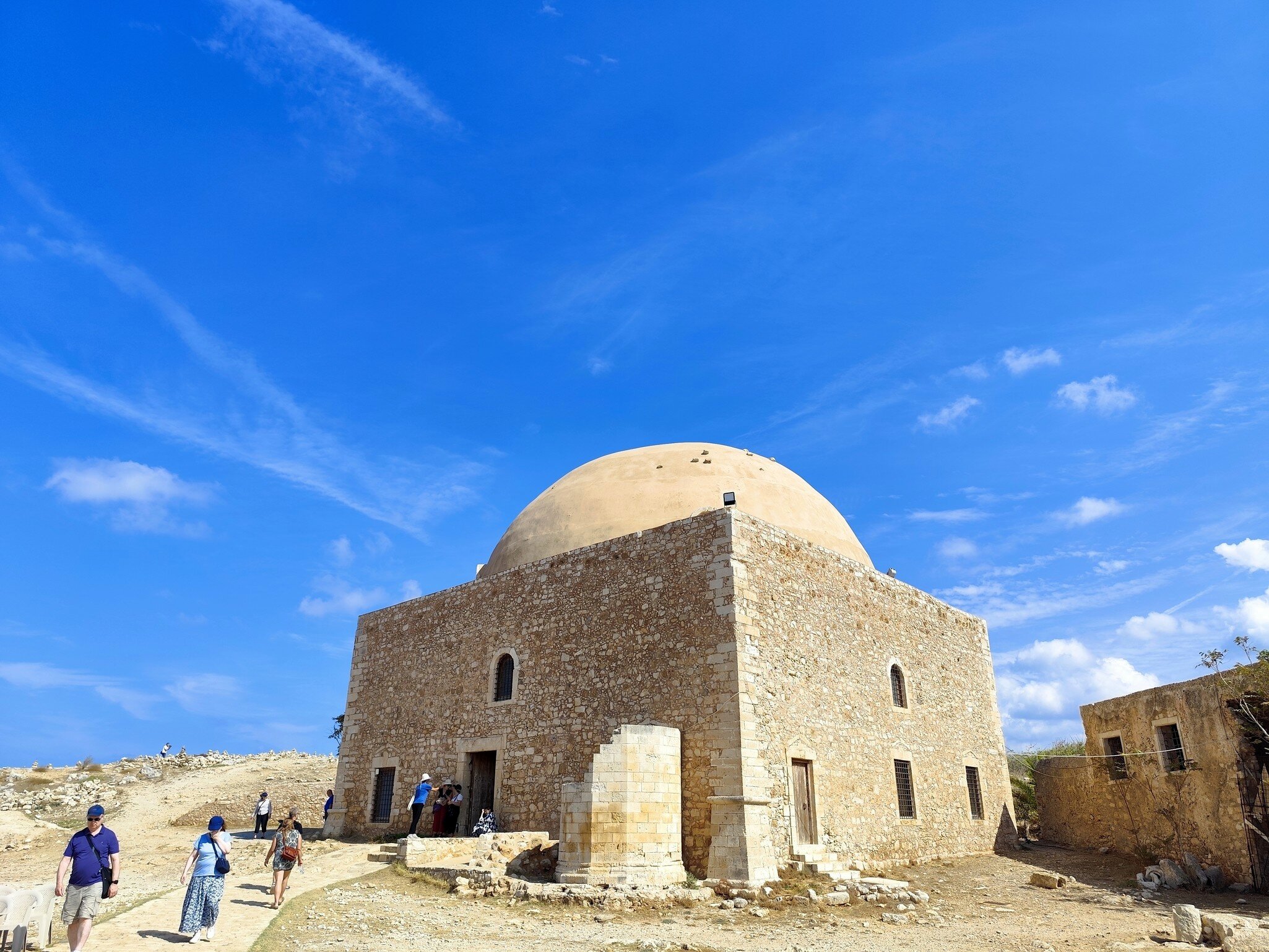 A group of tourists exits the Ibrahim Khan Mosque in Fortezza Fortress in Rethymno, Crete.