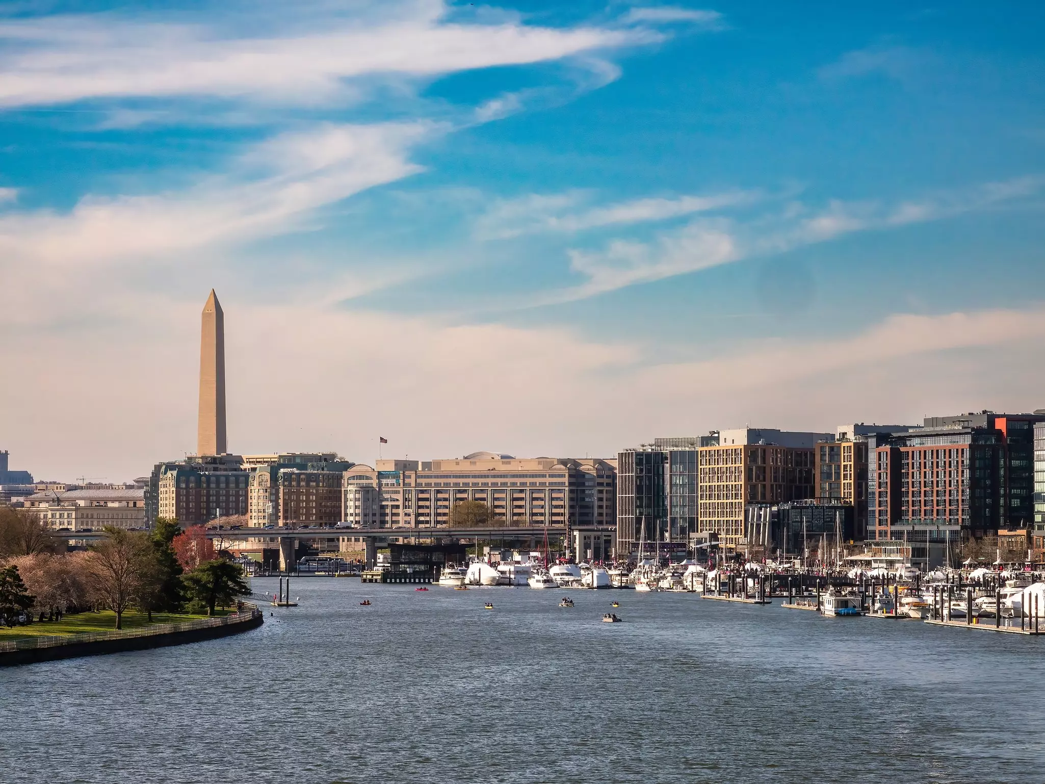 Late afternoon view of Southwest Waterfront, with marinas and hotels in The Wharf entertainment district, along the Potomac River. (Washington Monument at left.)