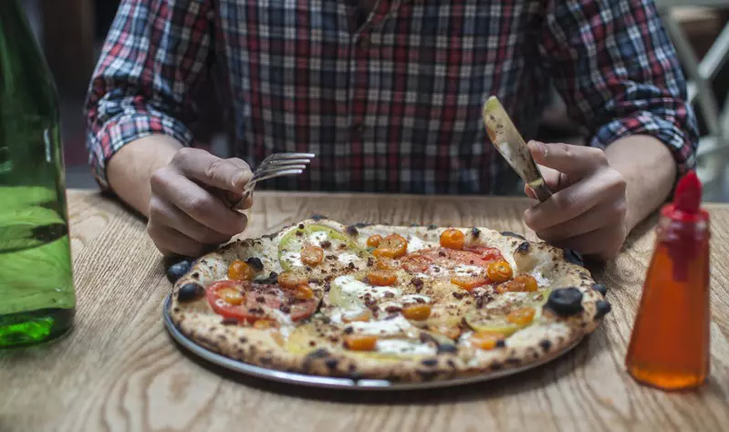 This is NOT how you eat a pizza in New York City or indeed most of New York © Sivan Askayo / Lonely Planet