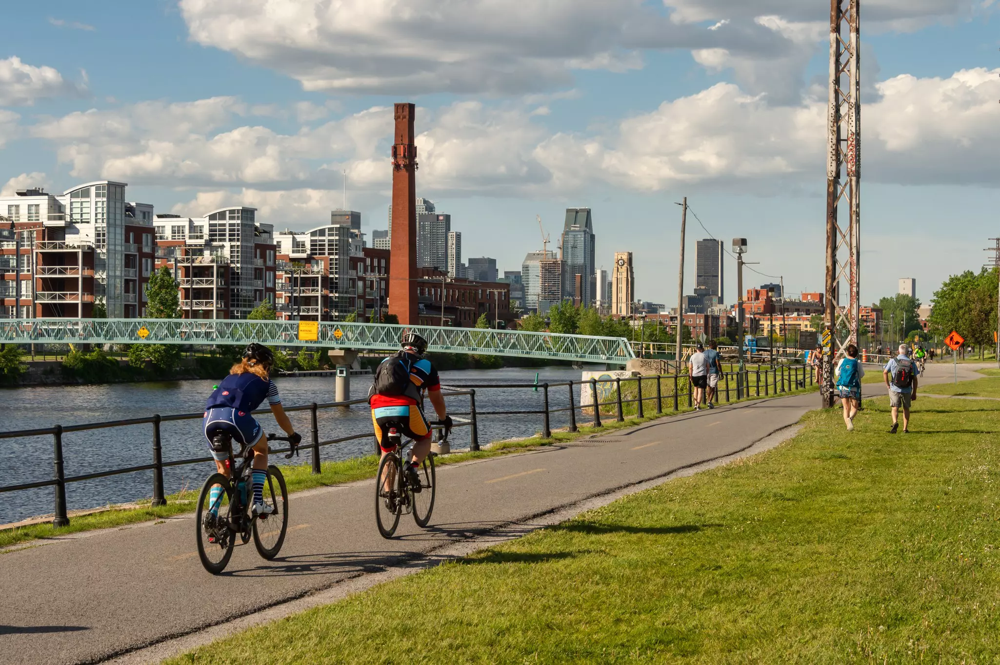 Cyclists and walkers enjoying a warm and sunny spring day along the Lachine Canal