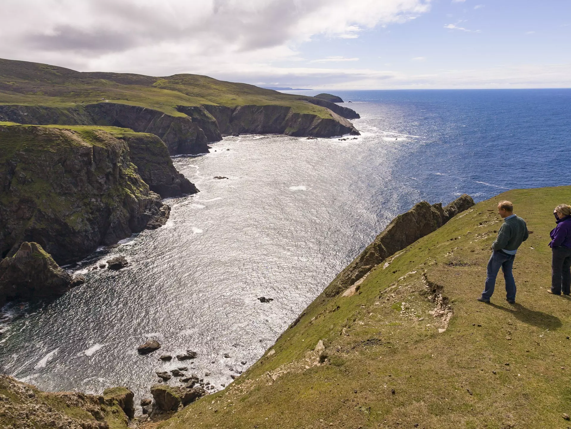  People look at cove, Atlantic coast, Aran Island.