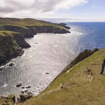  People look at cove, Atlantic coast, Aran Island.