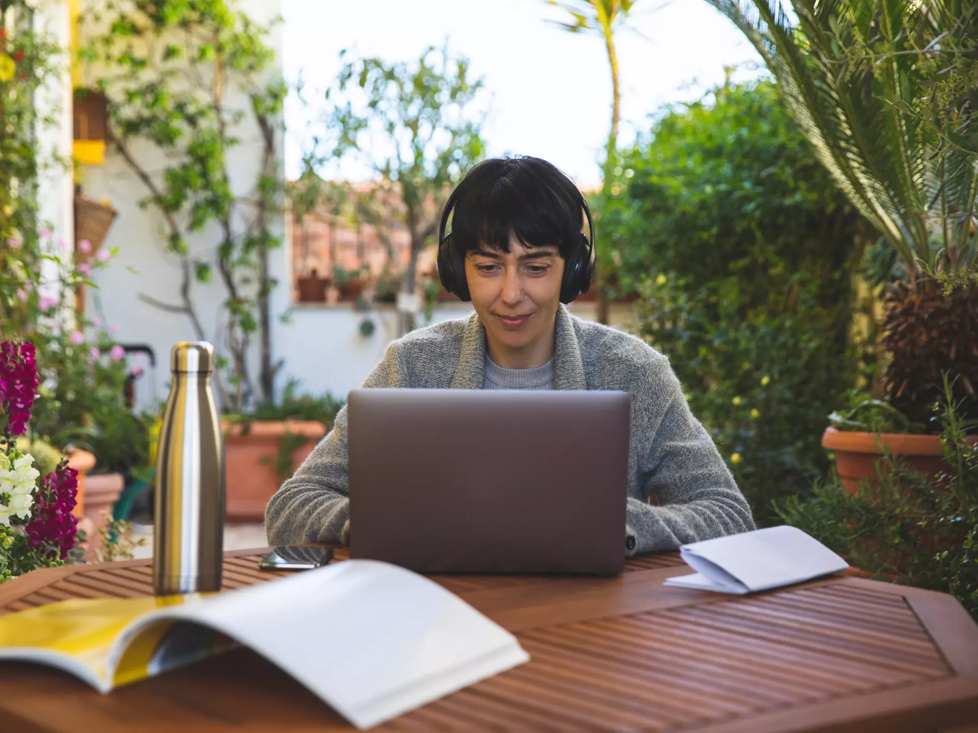 Woman at work from home patio in
