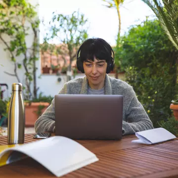 Woman at work from home patio in