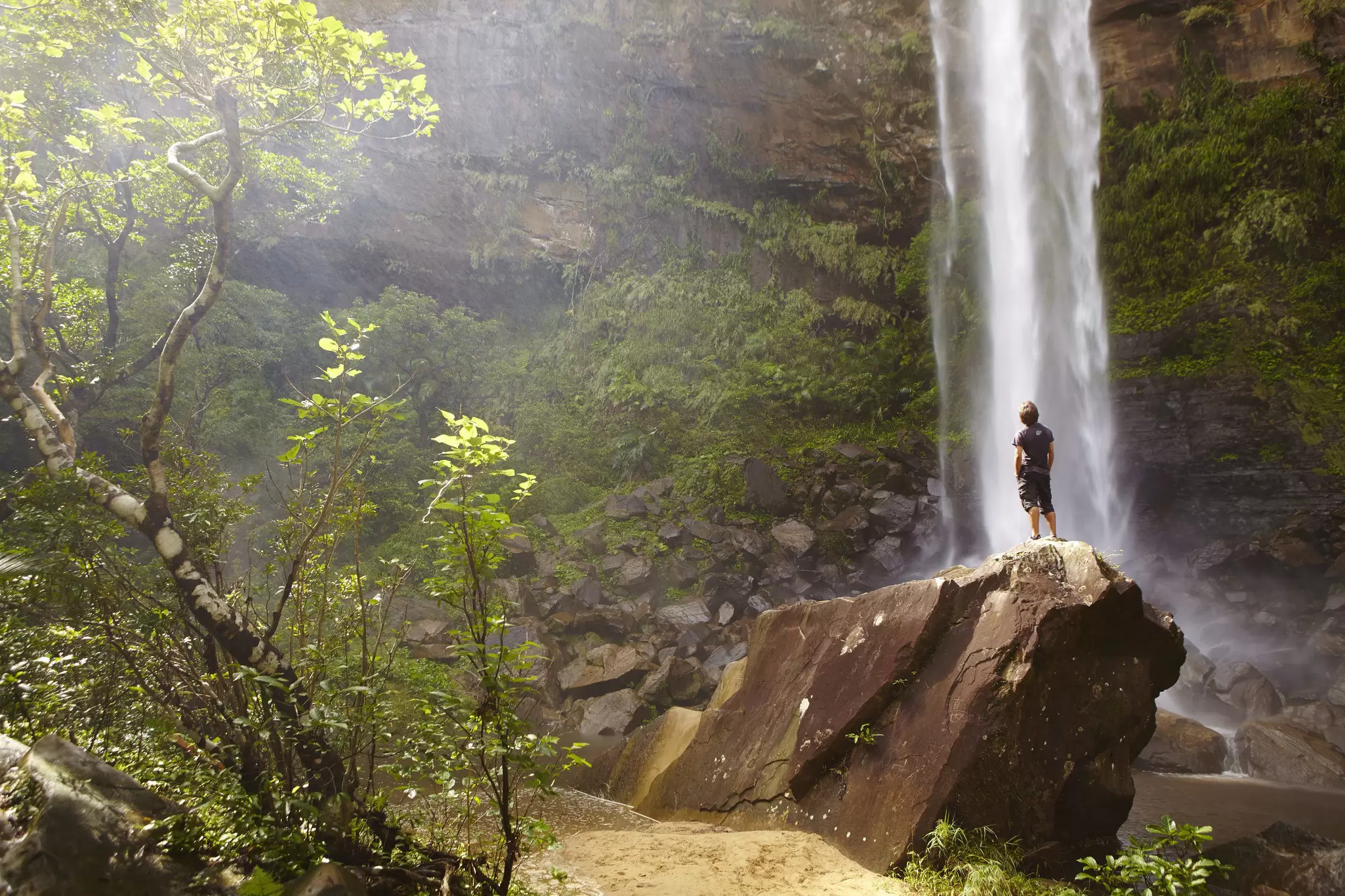 Man looking up at Pinaisara Falls. Found on Iriomote Island it's said to look like a white flowing beard, hence it's name: pinai, ‘beard’ and sara, ‘hanging down’
Lonely Planet Traveller Magazine, Issue92, August, Japan, Okinawa, islands