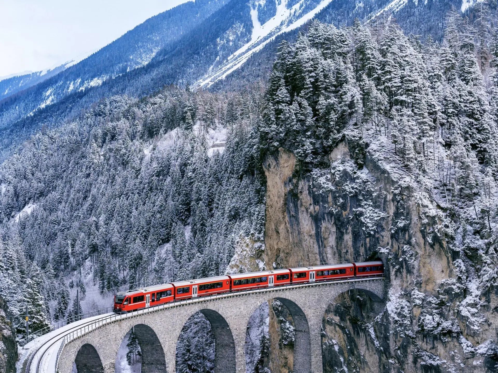 The Bernina Express runs through the Landwasser Viaduct in Switzerland. Shutterstock