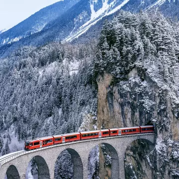 The Bernina Express runs through the Landwasser Viaduct in Switzerland. Shutterstock
