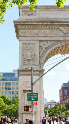A large ornamental archway at a city junction.