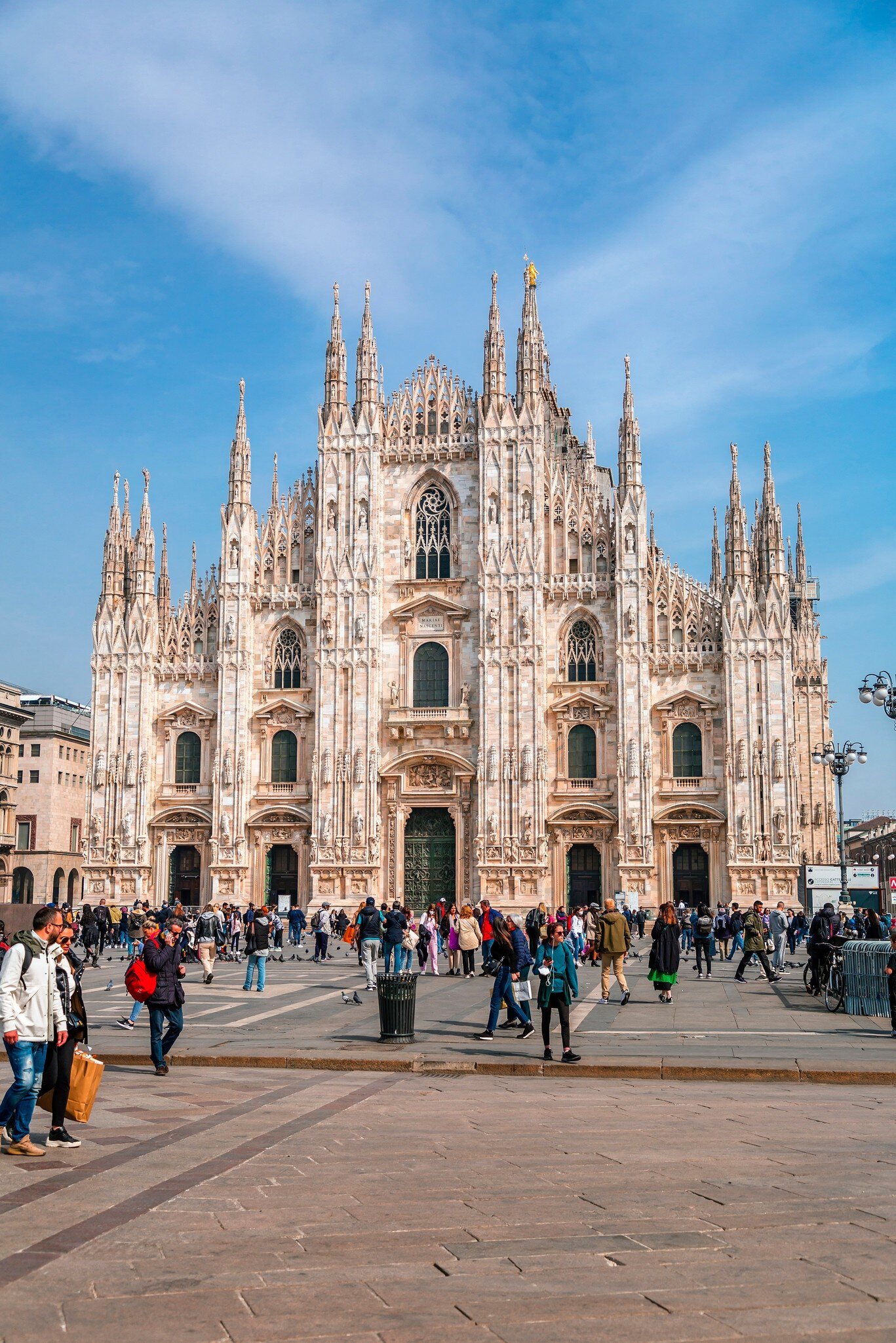 Crowds of tourists outside the Milan Cathedral.