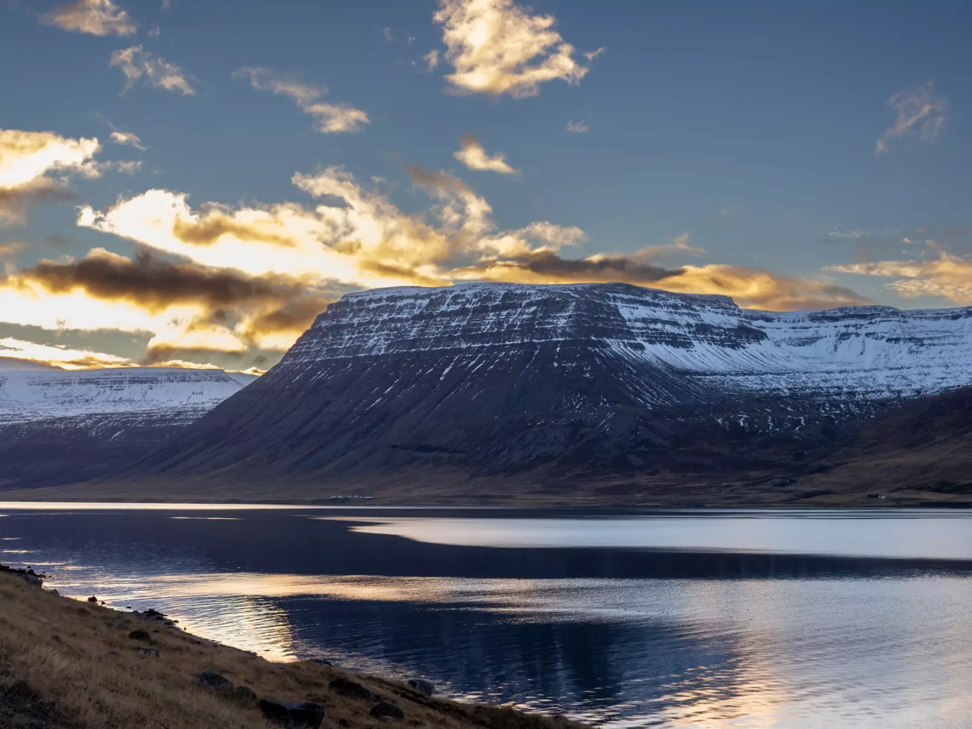 Mountains touched with snow. Colorful clouds on the blue sky during sunset Calm water of the Atlantic ocean in the fjord. Area of Westfjords, Isafjordur, Iceland., License Type: media, Download Time: 2025-11-24T19:05:45.000Z, User: comptonsheldon109, Editorial: false, purchase_order: 56530 - Guidebooks, job: Global Publishing WIP, client: Experience Iceland 2, other: Compton Sheldon