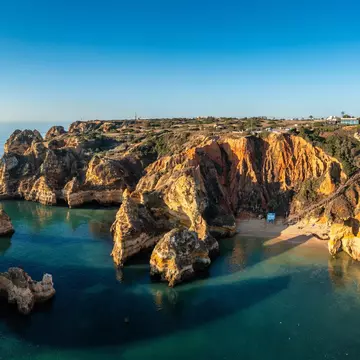 Praia do Camilo in Lagos, Algarve, Portugal. DaLiu/Shutterstock