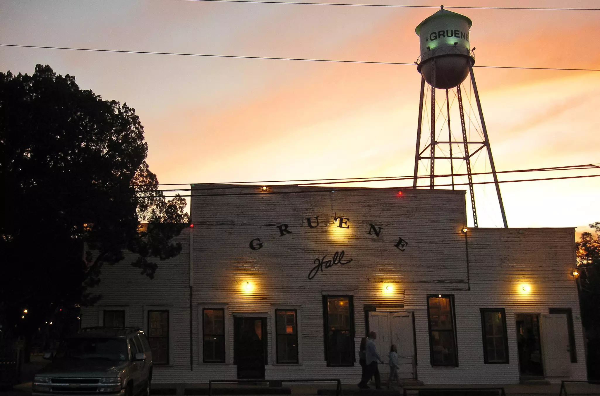 Exterior of Gruene Hall, the oldest dance hall in Texas, during sunset.