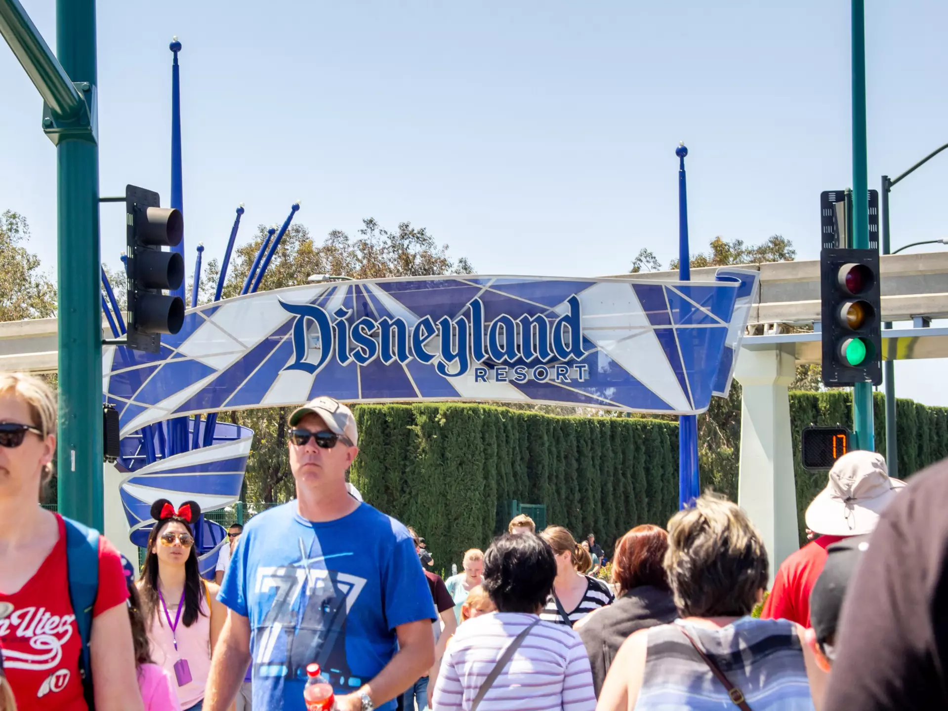 Anaheim, California/United States - 04/24/2019: Tourist walk across the street towards Disneyland theme park  License Type: media  Download Time: 2023-05-20T07:55:07.000Z  User: claramonitto  Is Editorial: Yes  purchase_order:   