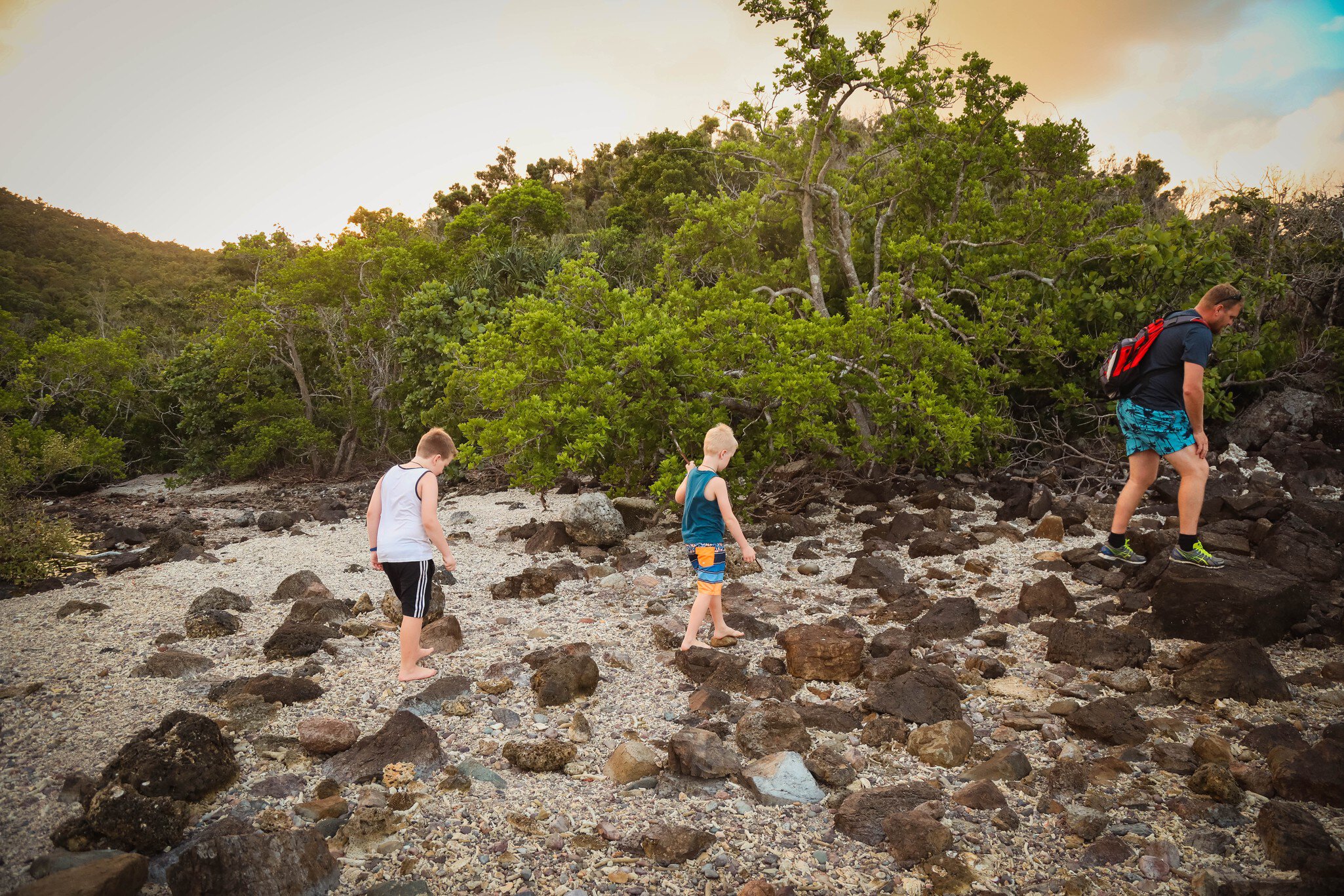 Airlie Beach, Queensland Australia - September 19 2019 : Father and two son's adventuring on Coral Beach in The Whitsundays; Shutterstock ID 1574598139; your: Sloane Tucker; gl: 65050; netsuite: Online Editorial; full: destination