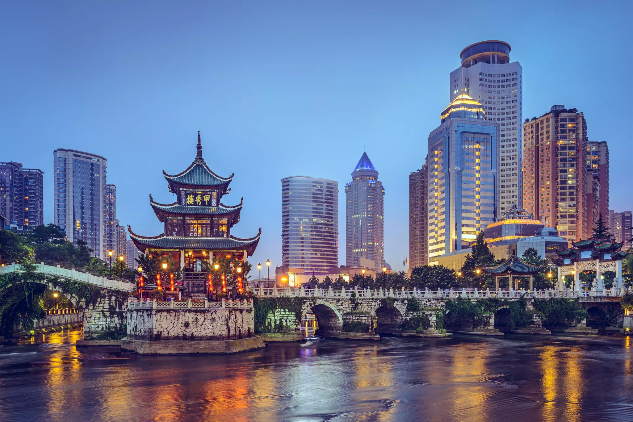The colorful Guiyang, China, skyline at Jiaxiu Pavilion on the Nanming River.
