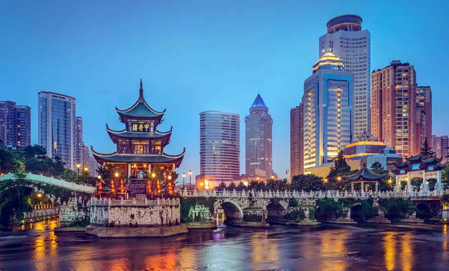 The colorful Guiyang, China, skyline at Jiaxiu Pavilion on the Nanming River.